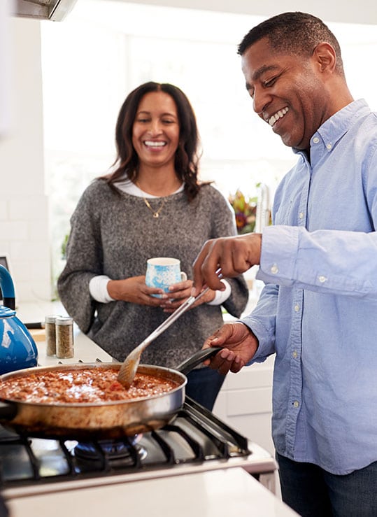 Couple smiling talking about erectile dysfunction